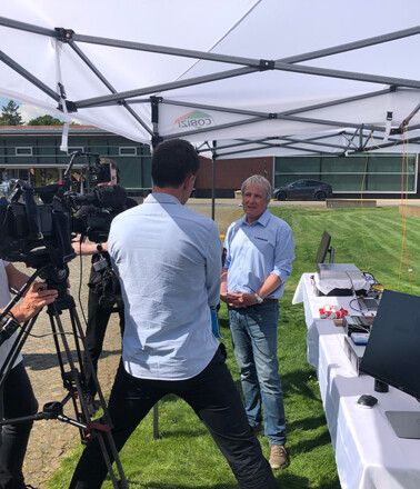 Filming of an interview about AP Sensing's Distributed Fiber Optic Sensing technology outdoors Filming of an interview about AP Sensing's Distributed Fiber Optic Sensing technology outdoors