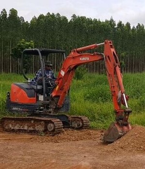 Mini excavator digs, site preparation for assets needing distributed fiber optic monitoring solutions Mini excavator digs, site preparation for assets needing distributed fiber optic monitoring solutions