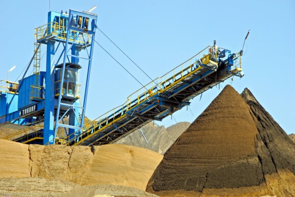 Bulk material conveyor and stockpiles in an industrial setting, monitored for safety by AP Sensing Bulk material conveyor and stockpiles in an industrial setting, monitored for safety by AP Sensing